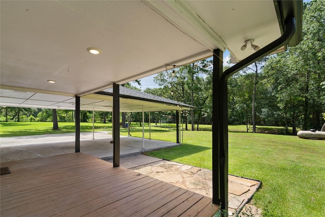 33933 Deer Creek Way, Stagecoach, TX 77355 - wooden terrace with a patio and a lawn