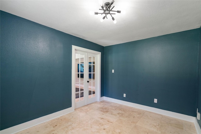 33933 Deer Creek Way, Stagecoach, TX 77355 - empty room featuring french doors and baseboards