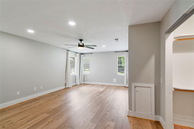 33933 Deer Creek Way, Stagecoach, TX 77355 - spare room featuring ceiling fan, light wood finished floors, and recessed lighting