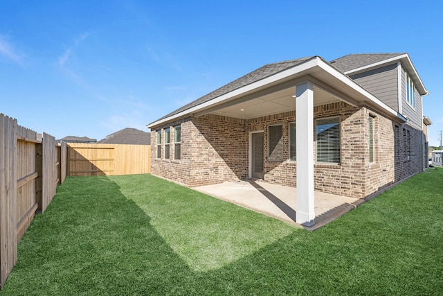 19376 Poppy Village Cir, Magnolia, TX 77355 - rear view of house featuring brick siding, a fenced backyard, and a patio area