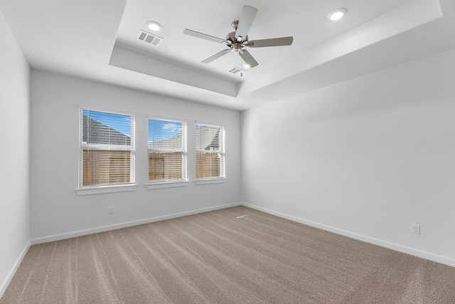 19376 Poppy Village Cir, Magnolia, TX 77355 - spare room featuring a raised ceiling, light colored carpet, a ceiling fan, and recessed lighting