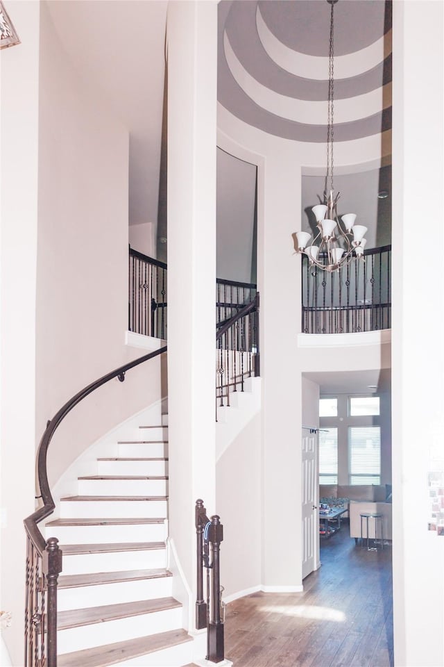 4300 Turnbridge Ct, Manvel, TX 77578 - stairs with a high ceiling, wood finished floors, and a chandelier