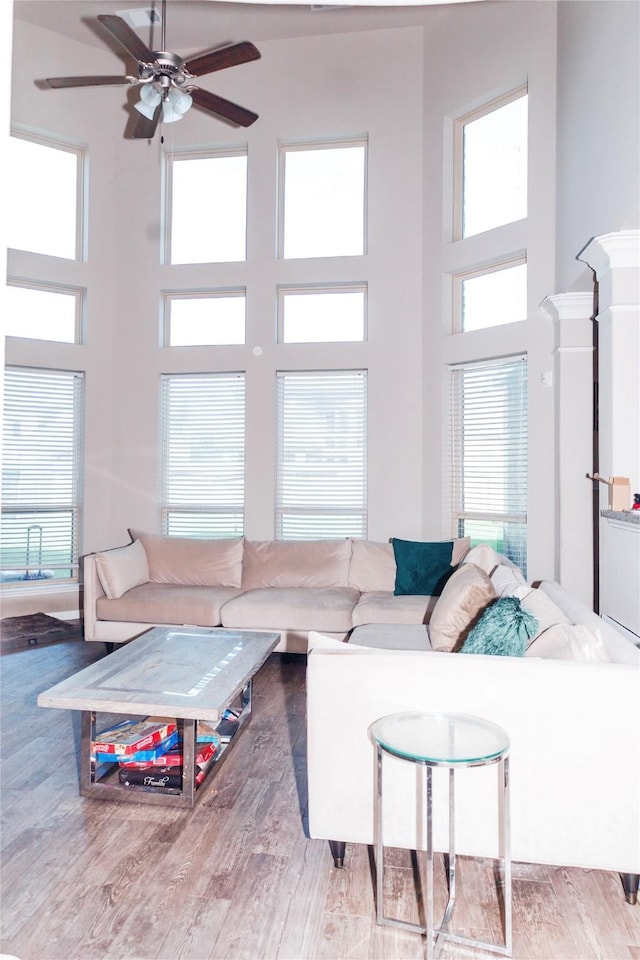 4300 Turnbridge Ct, Manvel, TX 77578 - living room with a towering ceiling, ceiling fan, and wood finished floors