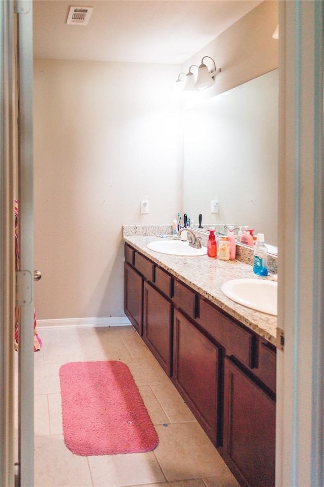 4300 Turnbridge Ct, Manvel, TX 77578 - full bathroom with double vanity and tile patterned flooring