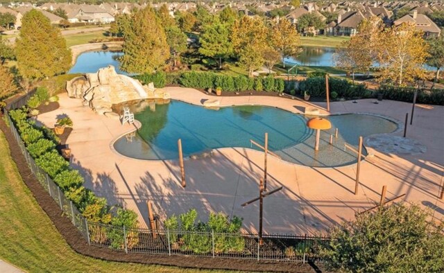 4300 Turnbridge Ct, Manvel, TX 77578 - community pool with a patio area, a water slide, a water view, and a residential view