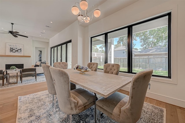 1506 W 43rd St, Houston, TX 77018 - dining area featuring healthy amount of natural light, light wood-type flooring, a chandelier, ceiling fan, and recessed lighting