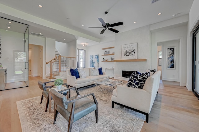 1506 W 43rd St, Houston, TX 77018 - living area featuring stairway, light wood-style flooring, recessed lighting, a ceiling fan, and a fireplace