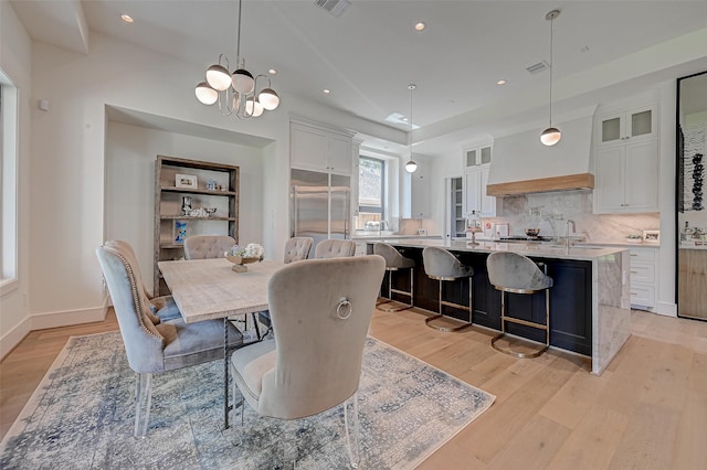 1506 W 43rd St, Houston, TX 77018 - dining room featuring light wood finished floors, recessed lighting, and a chandelier