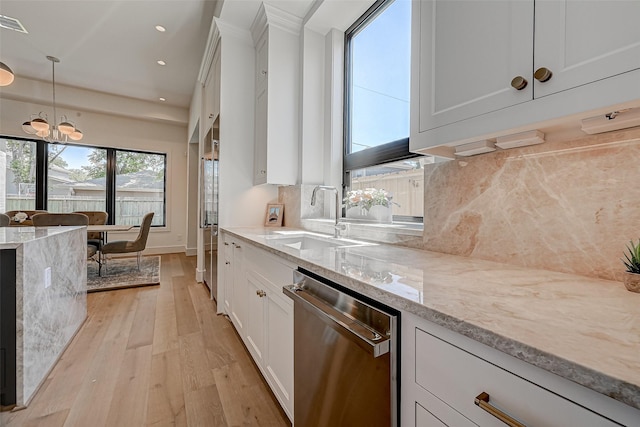 1506 W 43rd St, Houston, TX 77018 - kitchen featuring stainless steel dishwasher, light wood-style flooring, white cabinetry, light stone countertops, and recessed lighting