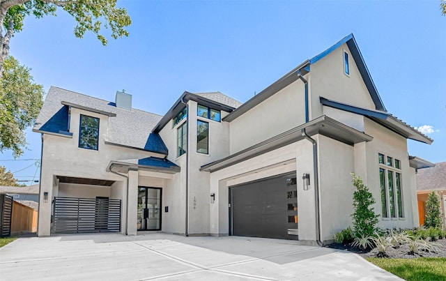 1506 W 43rd St, Houston, TX 77018 - view of front of home with a garage, concrete driveway, stucco siding, a chimney, and roof with shingles
