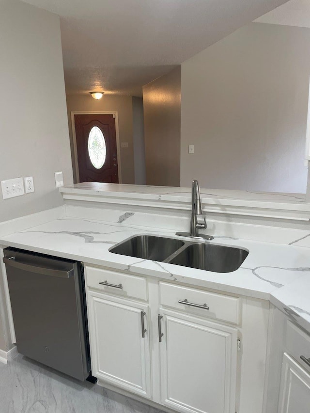 9311 Rippling Fields Dr, Houston, TX 77064 - kitchen with dishwasher, white cabinets, light stone counters, and light marble finish flooring