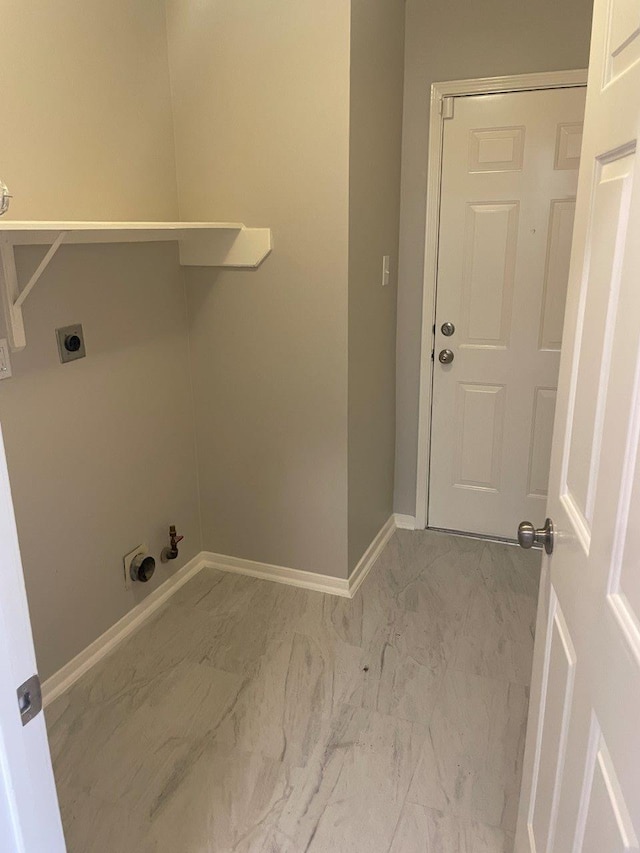 9311 Rippling Fields Dr, Houston, TX 77064 - laundry area with light marble finish floors, hookup for an electric dryer, and gas dryer hookup