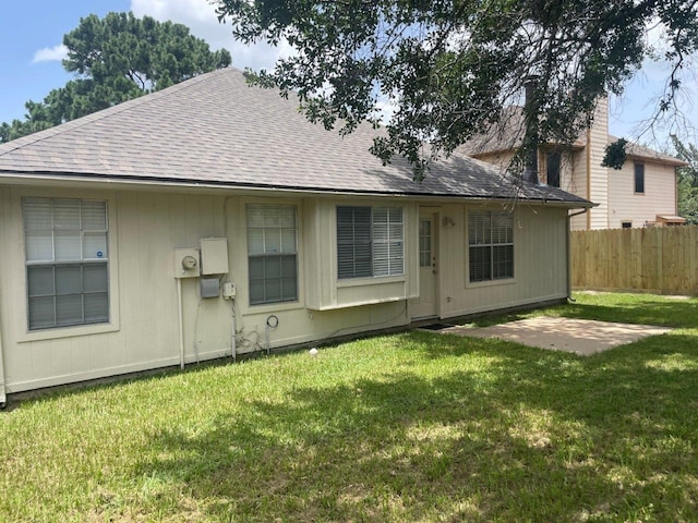 9311 Rippling Fields Dr, Houston, TX 77064 - rear view of house with a shingled roof and a patio area
