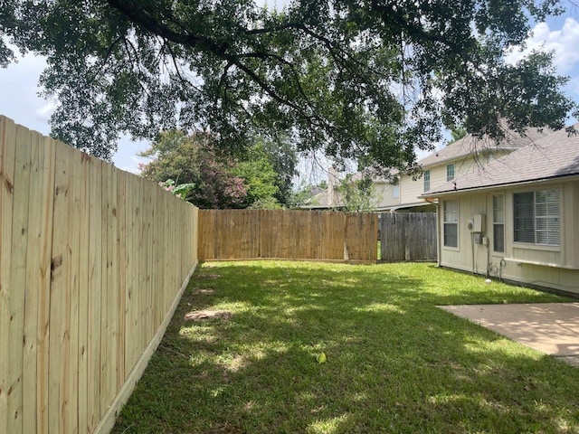 9311 Rippling Fields Dr, Houston, TX 77064 - fenced backyard with a patio area
