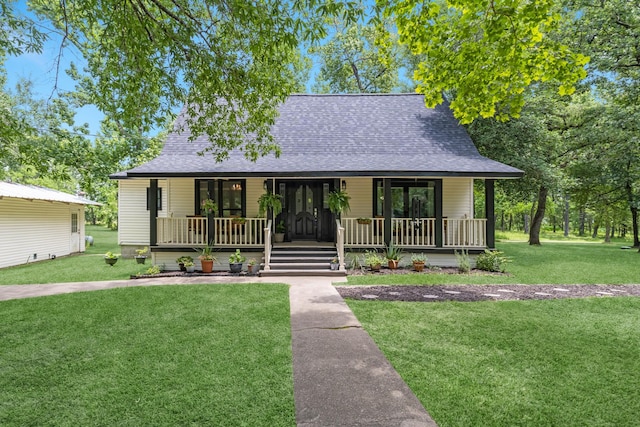 8918 James Ct, Magnolia, TX 77354 - view of front facade with a porch, roof with shingles, and a front yard