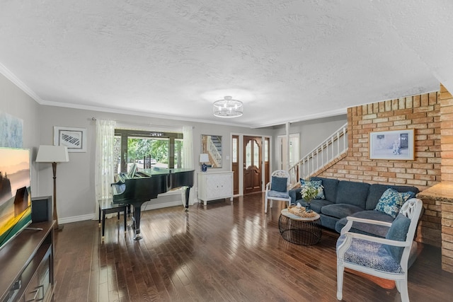 8918 James Ct, Magnolia, TX 77354 - living room with stairs, a textured ceiling, hardwood / wood-style floors, a chandelier, and ornamental molding