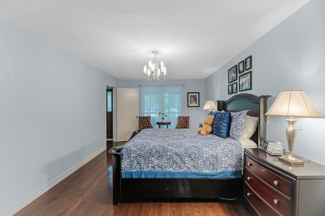 8918 James Ct, Magnolia, TX 77354 - bedroom with wood finished floors and a chandelier