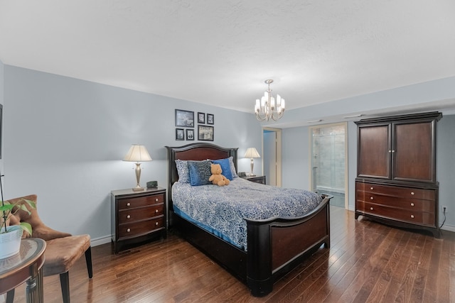 8918 James Ct, Magnolia, TX 77354 - bedroom with dark wood-style flooring and a chandelier
