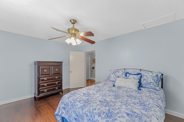8918 James Ct, Magnolia, TX 77354 - bedroom featuring dark wood-style floors, attic access, and a ceiling fan