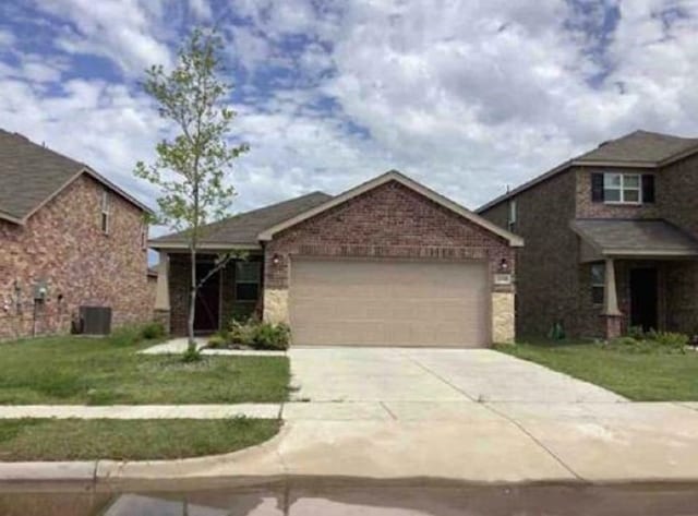 2041 Henrietta Dr, Forney, TX 75126 - view of front of house with a garage, driveway, and a front lawn