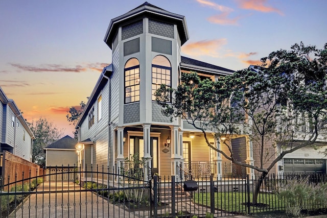 1022 W 22nd St, Houston, TX 77008 - view of front of house featuring covered porch, a gate, and a fenced front yard