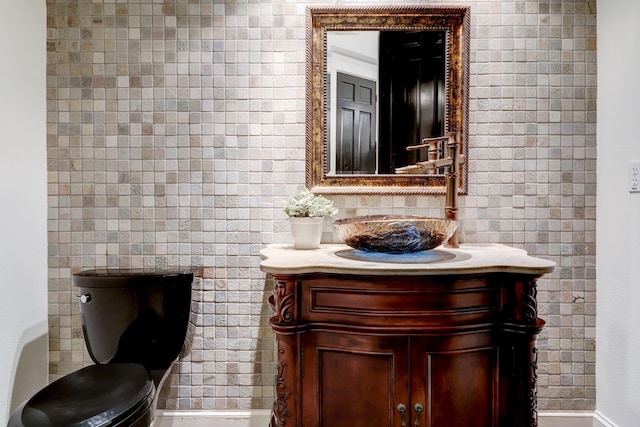 1022 W 22nd St, Houston, TX 77008 - half bathroom featuring vanity and toilet