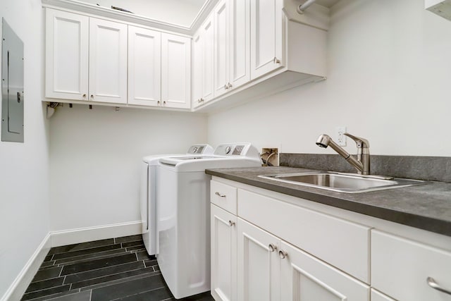 1022 W 22nd St, Houston, TX 77008 - laundry room with washer and dryer, cabinet space, electric panel, and wood finish floors
