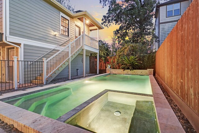 1022 W 22nd St, Houston, TX 77008 - view of pool with a fenced backyard, a pool with connected hot tub, and stairs