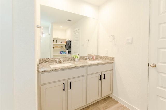 31714 Brandon Mill Trl, Fulshear, TX 77441 - bathroom featuring double vanity and a shower with door