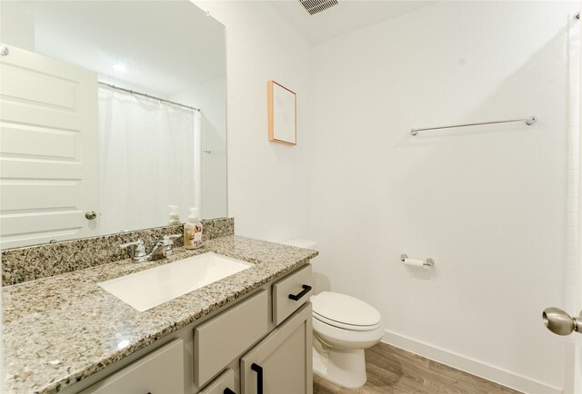 31714 Brandon Mill Trl, Fulshear, TX 77441 - full bath with wood finished floors, vanity, and a shower with shower curtain