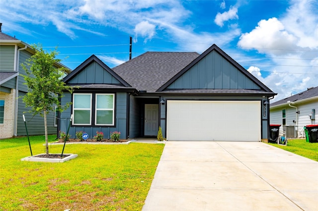 31714 Brandon Mill Trl, Fulshear, TX 77441 - view of front facade featuring board and batten siding, a garage, concrete driveway, and a front yard