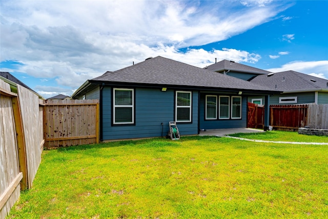 31714 Brandon Mill Trl, Fulshear, TX 77441 - back of property with roof with shingles, a fenced backyard, and a patio area