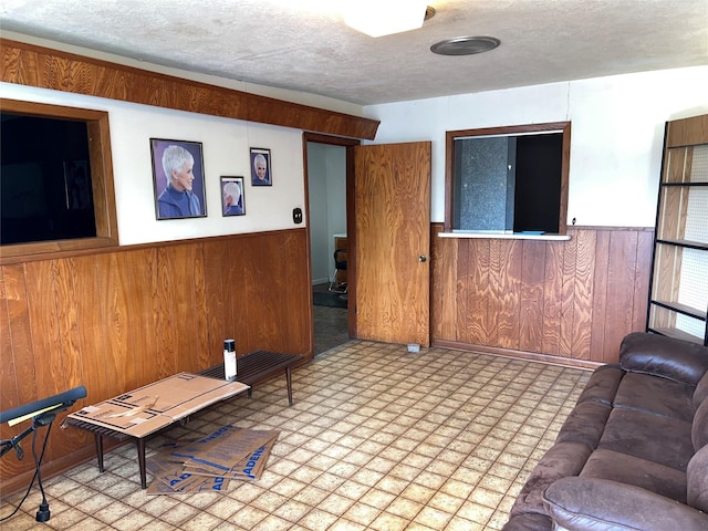 810 Thomas Ave, Pasadena, TX 77506 - living room featuring a wainscoted wall and wood walls