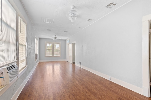 714 44th St, Galveston, TX 77550 - unfurnished room with a ceiling fan, wood finished floors, and a textured ceiling