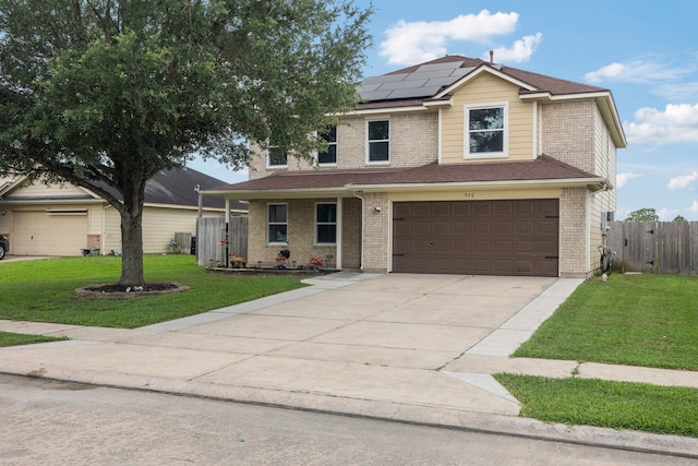 926 Seabourne Meadows Dr, Rosenberg, TX 77471 - traditional-style home with roof mounted solar panels, an attached garage, driveway, and brick siding