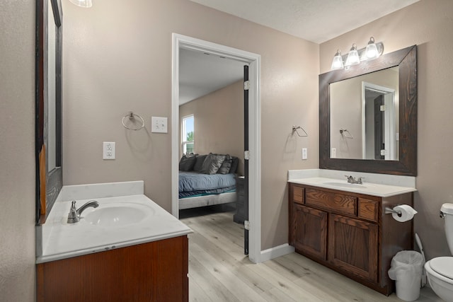 926 Seabourne Meadows Dr, Rosenberg, TX 77471 - ensuite bathroom with vanity and wood finished floors