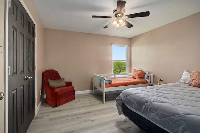 926 Seabourne Meadows Dr, Rosenberg, TX 77471 - bedroom featuring light wood finished floors and a ceiling fan