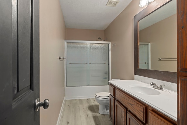 926 Seabourne Meadows Dr, Rosenberg, TX 77471 - bathroom featuring wood finished floors, vanity, and combined bath / shower with glass door