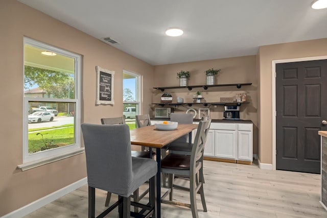 926 Seabourne Meadows Dr, Rosenberg, TX 77471 - dining room with light wood-style floors and baseboards