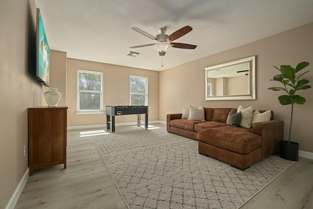 926 Seabourne Meadows Dr, Rosenberg, TX 77471 - living room with ceiling fan and light wood-style flooring
