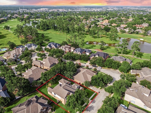 7815 Camden Hollow Ln, Humble, TX 77396 - aerial view at dusk of a residential view, a water view, property boundaries highlighted, and view of golf course