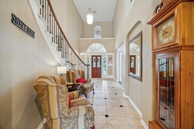 7815 Camden Hollow Ln, Humble, TX 77396 - foyer entrance featuring light tile patterned floors, a towering ceiling, and stairway
