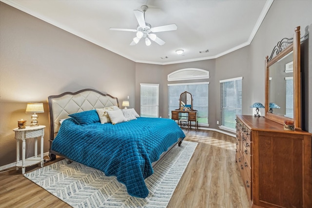 7815 Camden Hollow Ln, Humble, TX 77396 - bedroom with light wood finished floors, ornamental molding, and a ceiling fan