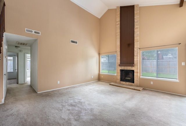 16830 Spruce Run Dr, Spring, TX 77379 - unfurnished living room featuring high vaulted ceiling, carpet, and a brick fireplace