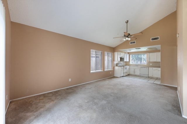 16830 Spruce Run Dr, Spring, TX 77379 - unfurnished living room featuring a ceiling fan, light colored carpet, and high vaulted ceiling