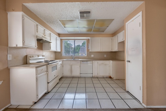 16830 Spruce Run Dr, Spring, TX 77379 - kitchen with white appliances, a textured ceiling, under cabinet range hood, and white cabinetry
