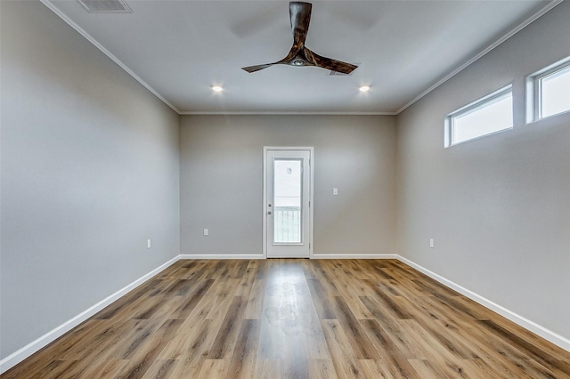 1743 Blue Water Hwy, Surfside Beach, TX 77541 - unfurnished room with crown molding, ceiling fan, wood finished floors, and recessed lighting