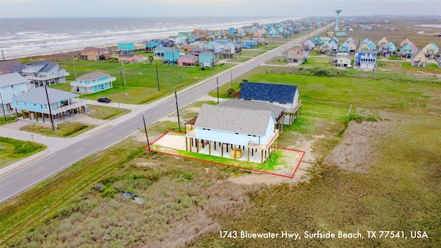 1743 Blue Water Hwy, Surfside Beach, TX 77541 - aerial view of residential area featuring property boundaries highlighted and a large body of water
