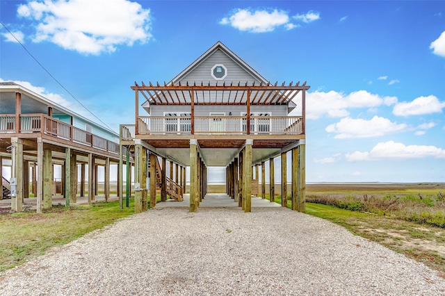 1743 Blue Water Hwy, Surfside Beach, TX 77541 - coastal home with a carport and gravel driveway