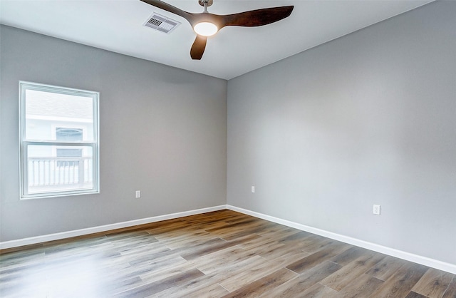 1743 Blue Water Hwy, Surfside Beach, TX 77541 - spare room featuring wood finished floors and ceiling fan